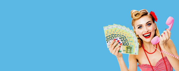 Photo of happy excited woman holding money euro cash banknotes, talking on phone, dressed in pin up...