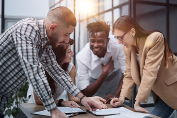 Ambitious smart employee speaks in a meeting and shares her opinion on a creative idea in a group briefing