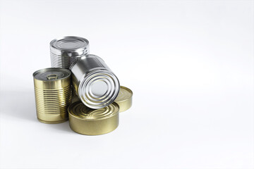 Cans with various products in close-up on a white background. Long-term storage products.