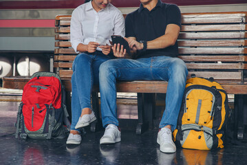 Cheap Travel and Lifestyle concept. Young Traveler man and woman (Couple of Love) wearing sneaker...