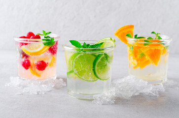 Summer Drinks Set, Fruit, Citrus and Berry Refreshing Lemonade or Cocktails on Bright Background