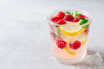 Refreshing Cold Cocktail or Mocktail with Berries and Lemon, Raspberry Lemonade