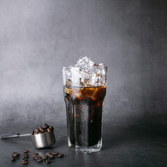 Americano iced coffee, menu coffee and roasted beans, coffee in a square spoon, background.