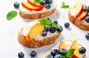 Homemade Toast with Blueberry, Peach and Cream Cheese, Delicious Summer Snack or Breakfast