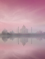 Fototapeta na wymiar Taj Mahal on sunrise sunset reflection in Yamuna river panorama in fog, Indian Symbol - India travel background. Agra, Uttar Pradesh, India