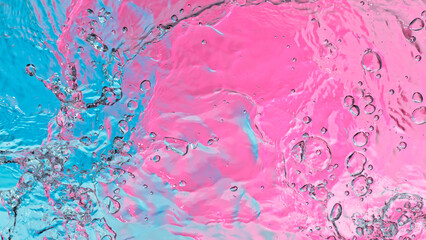 Freeze motion of splashing water surface on light neon background