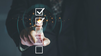 Check list, Businessman Take an assessment, questionnaire, evaluation, online survey exam Choosing the right answer in the exam, filling out an online survey form. Answer the test questions.