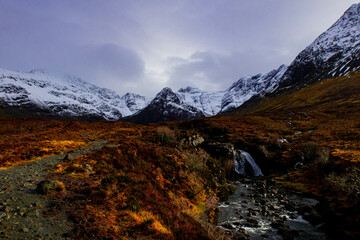 Fairy pools in Isle of Skye, snow topped mountain view