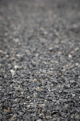 Wallpaper picture of gray granite pebbles floor with a blurred background for graphic design work