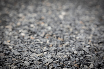 Wallpaper picture of gray granite pebbles floor with a blurred background for graphic design work