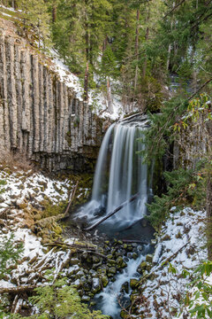 View of Spirits Creek Falls immersed in the snowy Ozark National Forest, Oregon, United States.