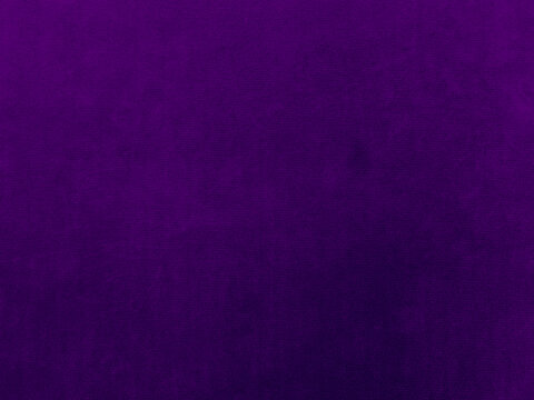 Dark purple velvet fabric texture used as background. Violet color panne fabric background of soft and smooth textile material. crushed velvet .luxury magenta tone for silk.