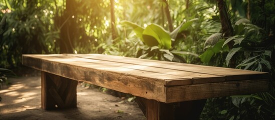 Empty wooden table in natural green garden