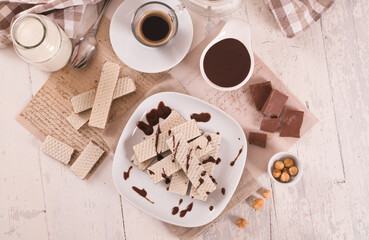Neapolitan wafers filling with hazelnut-chocolate cream. - 624461969