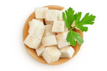 Fresh celery root with leaf in wooden bowl isolated on white background. Top view. Flat lay.