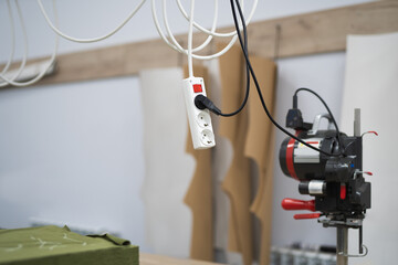 electrical extension cord with sockets for appliances at the factory
