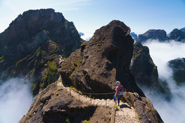 Hiker on PR1 Pico do Arieiro - Pico Ruivo trail Stairway to Heaven Madeira Portugal - 624465336