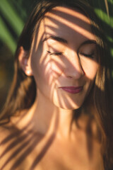 Fototapeta premium beautiful sexy girl alone in the jungle among leaves and trees