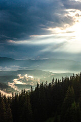 landscape, the sky after a thunderstorm, clouds in the mountains after the rain, a ray of the sun, light, the sun rises, morning, fog, above the clouds, wallpaper, poster, cover, the nature