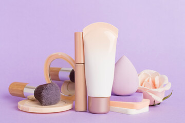 Composition with makeup products for skin tone on color background
