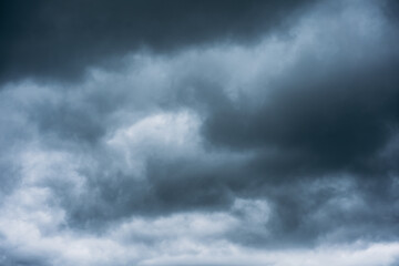 Fototapeta premium Overcast sky with dark clouds. Dark sky before a thunder-storm. The gray cloud background before rain.