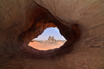 Rock formation with an erosive window in the Sahara desert, Algeria
