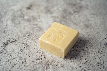 Goat Soap over gray background. Zero waste, natural organic bathroom tools. Plastic free life. Ecological skin care, body treatment concept