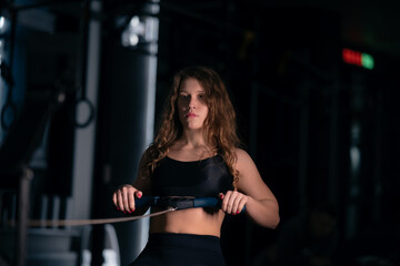 Obraz na płótnie Canvas Athletic Beautiful Woman Does her cross fitness at gym
