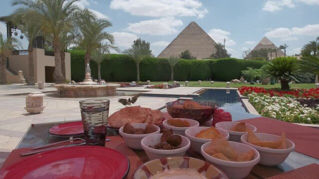 Egyptian food is on a table. Restaurant. Arabic cuisine. Pyramids of Giza.
