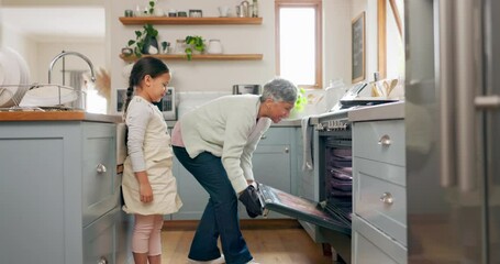 Kitchen, teaching and grandmother cooking with child learning to prepare dinner, supper or lunch in a home. Grandchild, support and grandma baking with kid and happy for a fresh meal together - Powered by Adobe