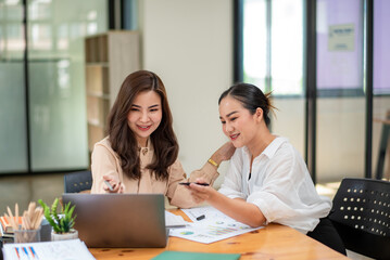 Two colleague businesswoman are meeting online, marketing plan, business plan, checking statistics and accounting.