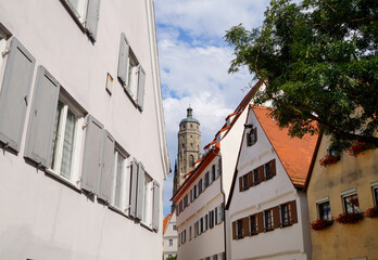 Fototapeta na wymiar a beautiful ancient Bavarian town of Noerdlingen with its half-timbered houses and Saint George's Church's steeple called 