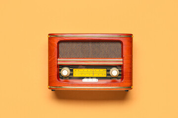 Retro radio receiver on color background