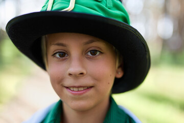 Portrait of a cute little boy dressed as a leprechaun for St Patrick's Day festival. Cheerful white...