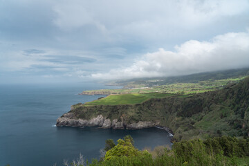 coastal view of the green hilly cliffs in the azores portugal