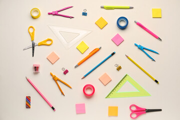 Composition with different stationery on light background