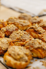 delicious fresh golden nutty pastries on baker's tray ready to be sold
