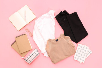 Composition with stylish school uniform, eyeglasses and notebooks on pink background