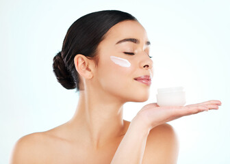 Skincare, face cream and woman with container in studio isolated on a white background. Lotion,...