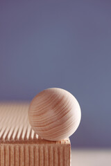 dimensional compositions of geometric shapes concept. wooden circle on texture box on blue background. copy space. abstract and still life, business