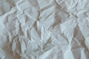 crumpled paper texture in gray, irregular shapes in an original and customizable background