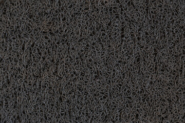 textured black background with irregular drawing of whimsical shape; thread amalgamation