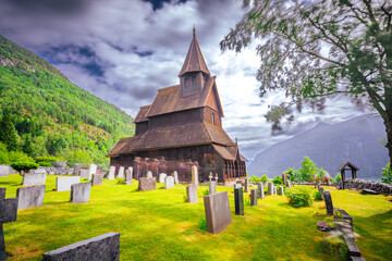 Fototapeta na wymiar Ornes, Norway - July 4th, 2023: The Urnes stave Church in the village of Ornes. A UNESCO world heritage site