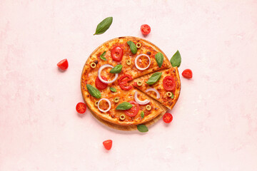 Board with tasty pizza, olives and basil on pink background