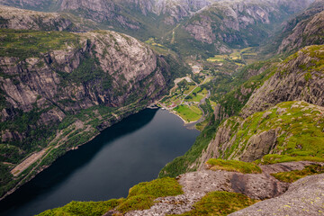 Fototapeta na wymiar Kjerag, Norway - July 5th, 2023: The epic mountain landscape on the famous Kjerag hike in southern Norway