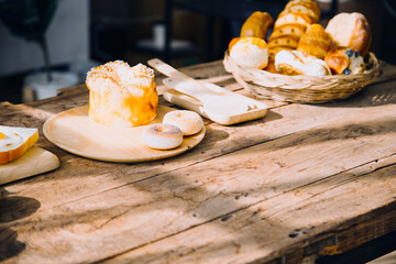 Young happy couple is enjoying and preparing healthy meal in their kitchen and reading recipes on the laptop.