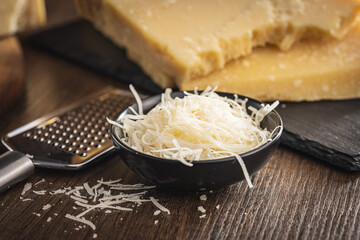 Tasty parmesan cheese. Grated cheese. - obrazy, fototapety, plakaty
