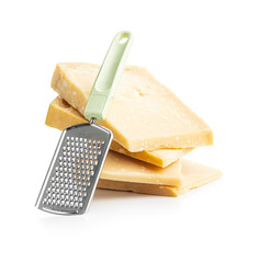 Tasty parmesan cheese and grater isolated on white background.