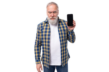 60s middle-aged gray-haired man with a beard in a shirt holding a phone on a white background