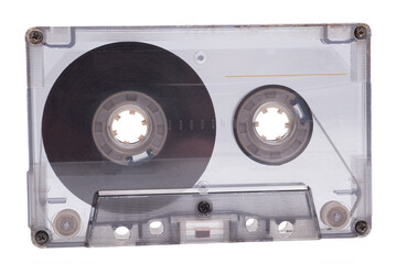 Vintage transparent audio cassette tape isolated on white background, 80's music concept.